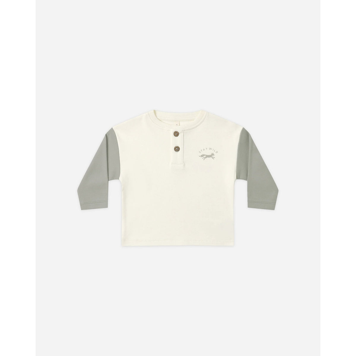 A toddler's long-sleeve henley shirt in off-white with sage green sleeves, featuring a three-button placket and a small graphic on the left chest.