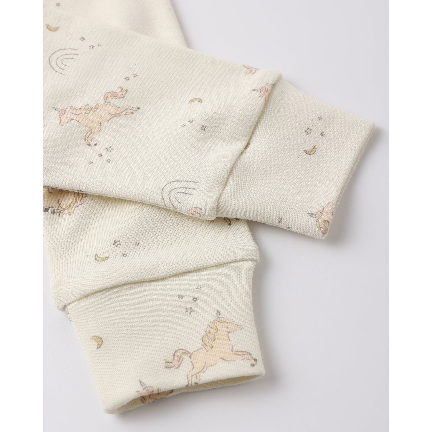 Folded fabric with unicorn pattern on a white background