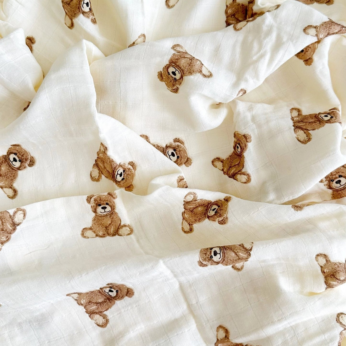 White fabric with brown teddy bear pattern