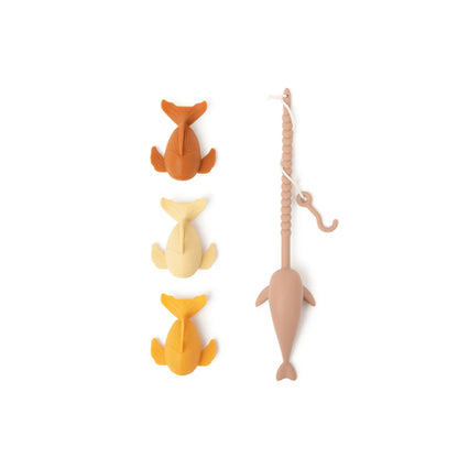 Set of four fish-shaped toys with a rope on a white background