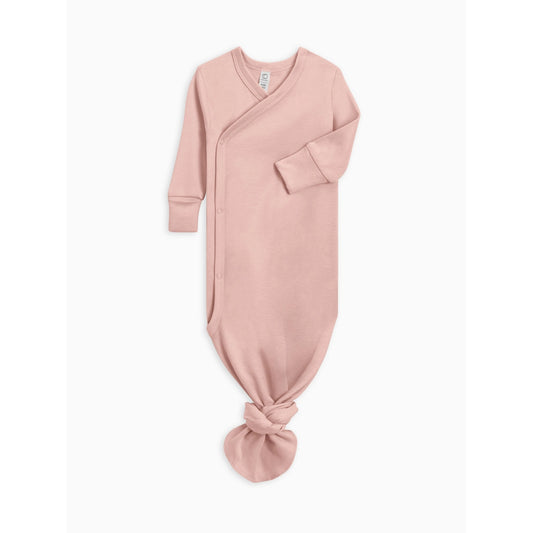 A dusty pink long-sleeve baby sleep sack with an asymmetrical wrap-style front and a knotted hem, shown flat against a light gray background.