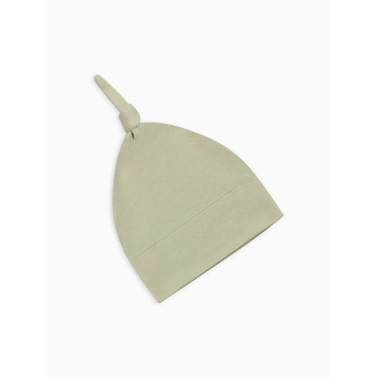 A light sage green knit baby hat with a knotted top, shown on a plain white background.