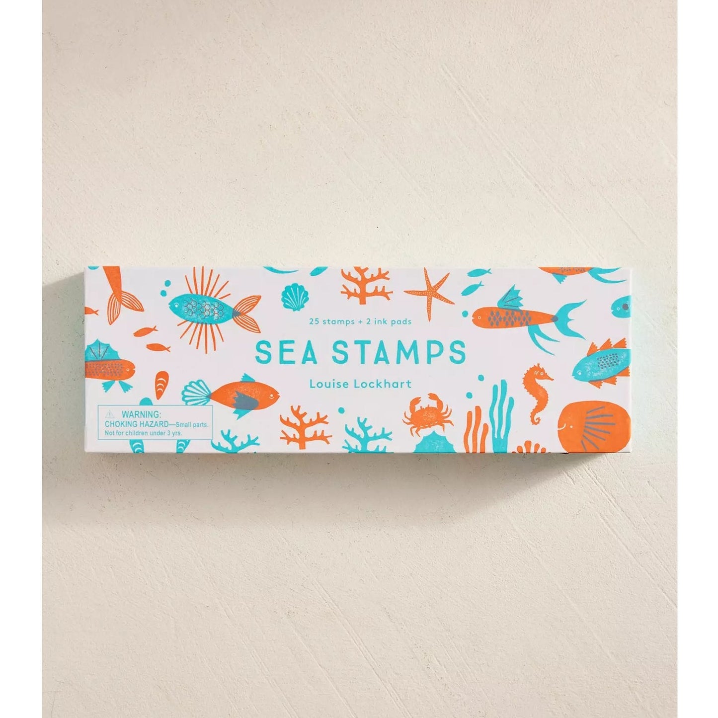 Box of sea stamps with colorful illustrations on a beige background