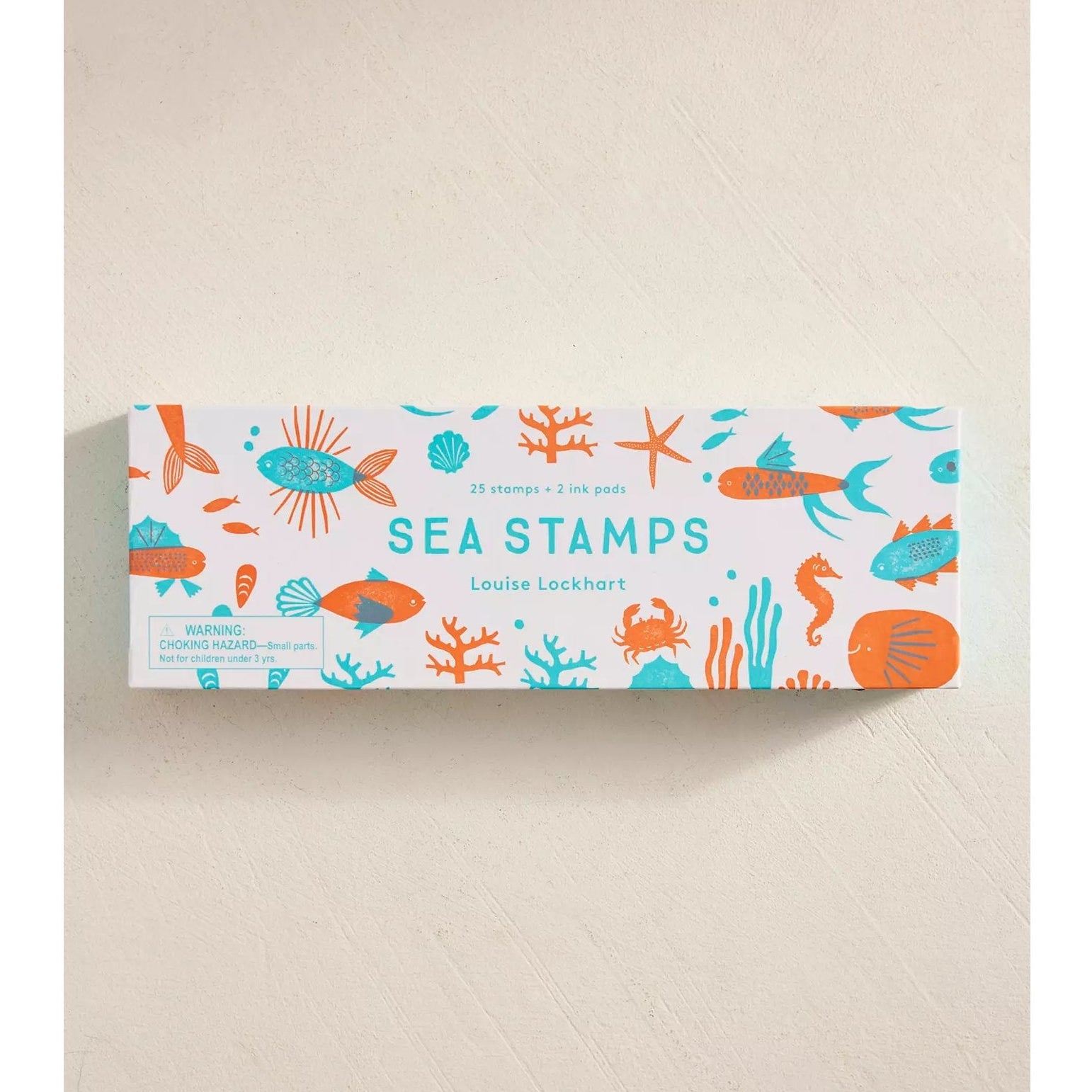 Box of sea stamps with colorful illustrations on a beige background