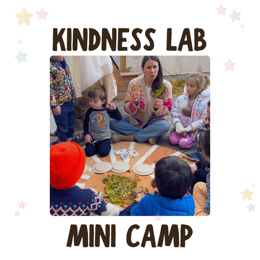 Children and adults participating in a 'Kindness Lab Mini Camp' activity.