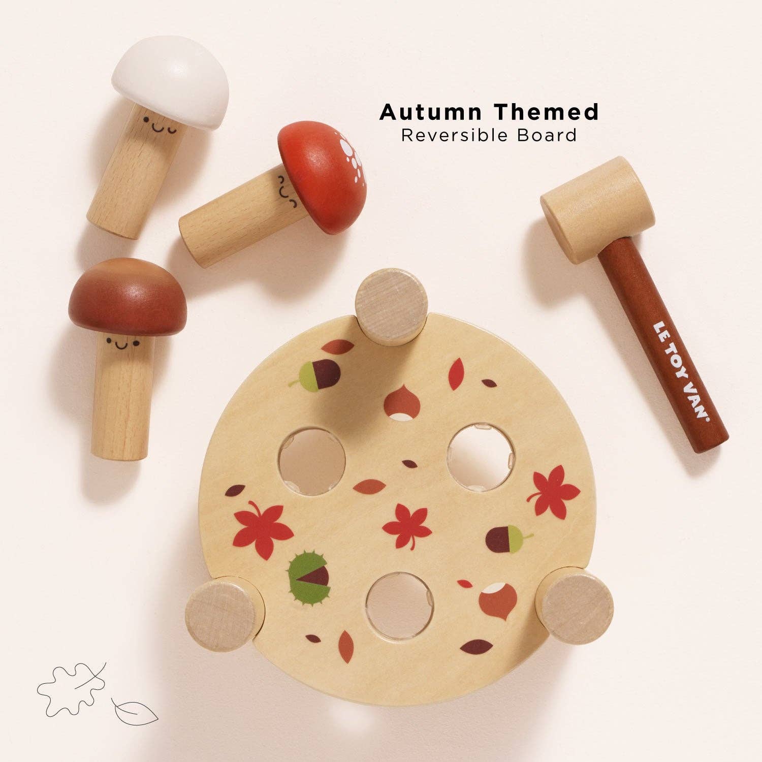 Wooden toy set with mushrooms and a reversible board on a white background