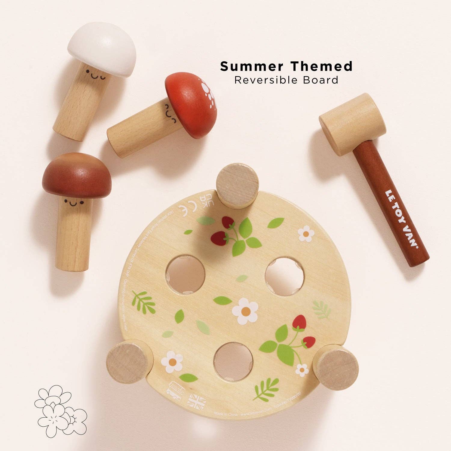 Wooden toy set with reversible design featuring mushrooms and a palette on a light background.