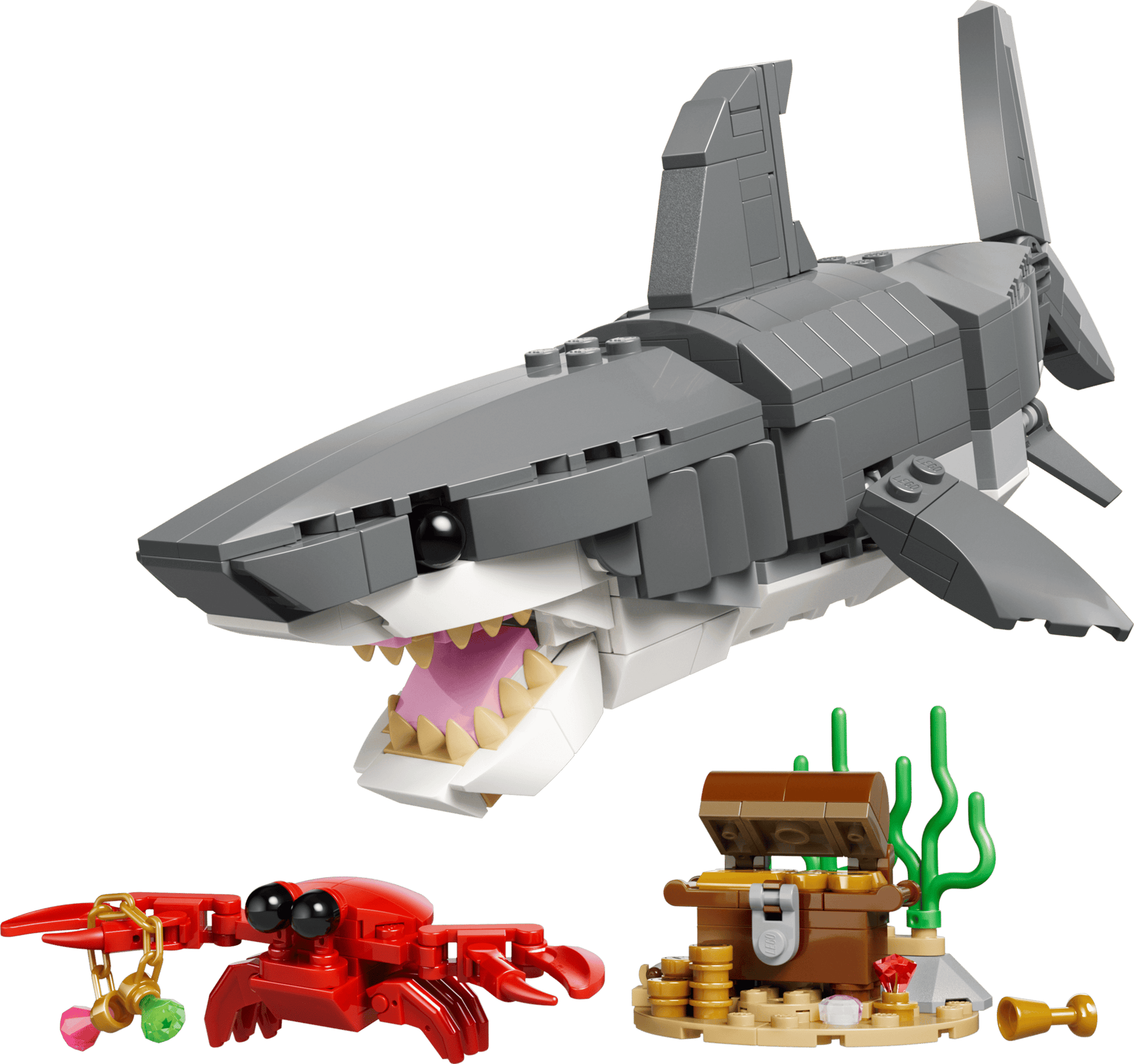 Toy shark model with a crab and treasure chest on a transparent background