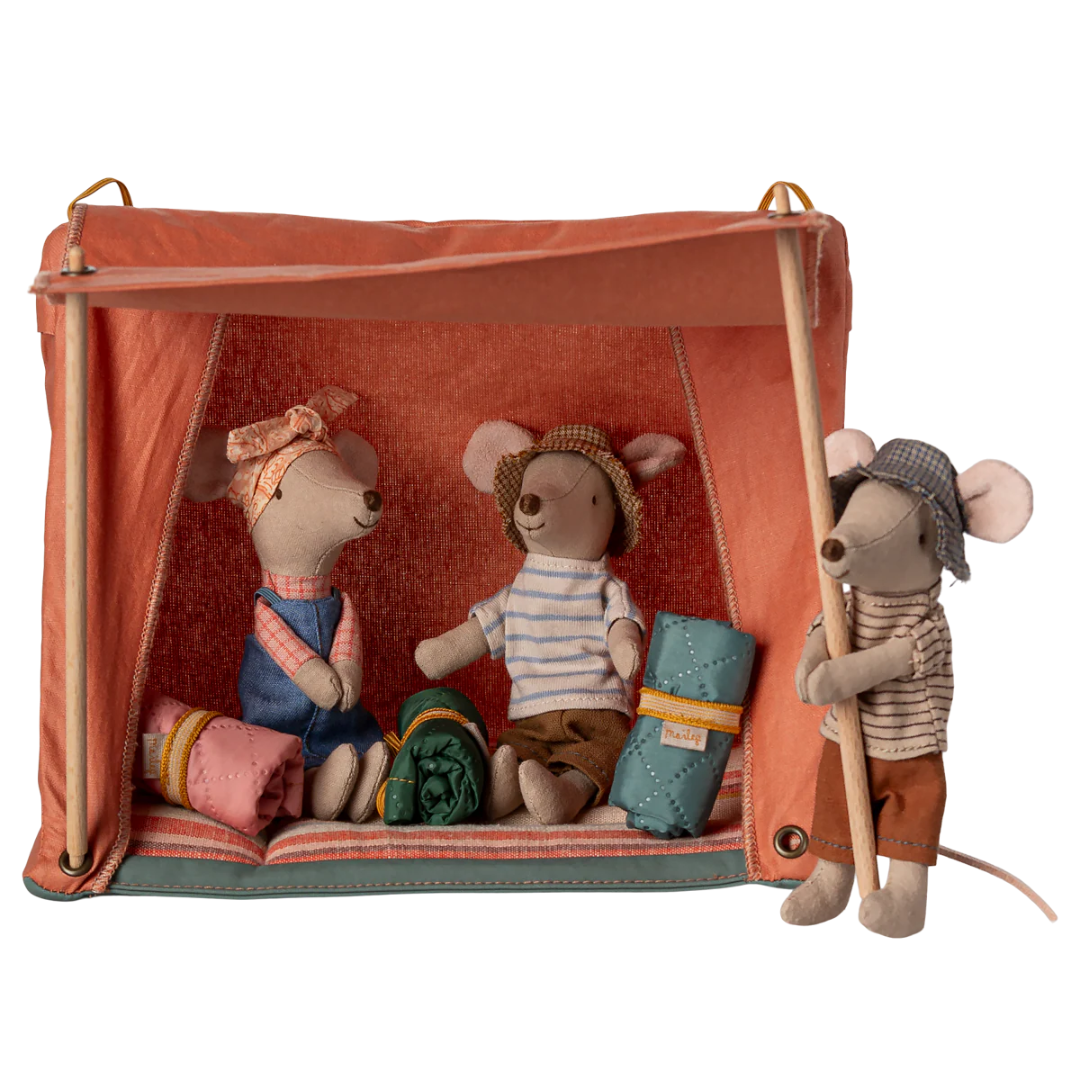 Three plush mouse toy figures dressed in vintage camping clothes, posed inside and beside a small orange canvas tent with wooden poles on a white background.