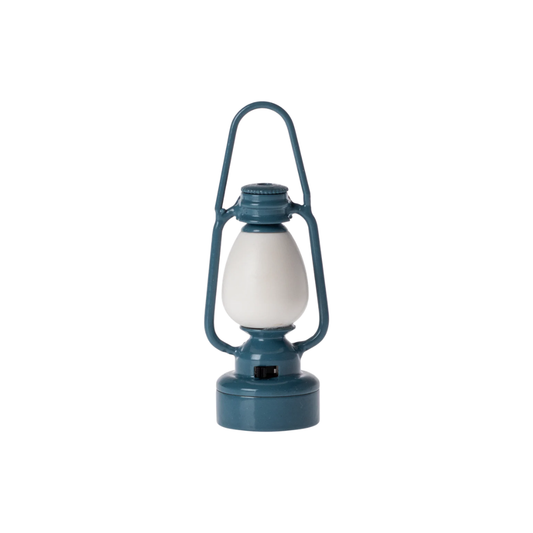 A classic-style lantern with a dark teal metal frame and a white frosted glass globe, shown against a plain white background.