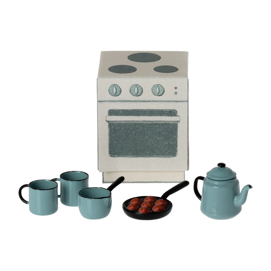 Set of miniature kitchen appliances and cookware on a white background