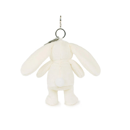 White plush keychain shaped like a cartoon character on a white background