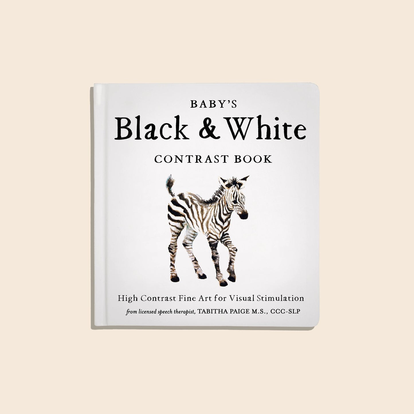 Book titled 'Baby's Black & White Contrast Book' with a zebra illustration on a beige background