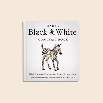 Book titled 'Baby's Black & White Contrast Book' with a zebra illustration on a beige background