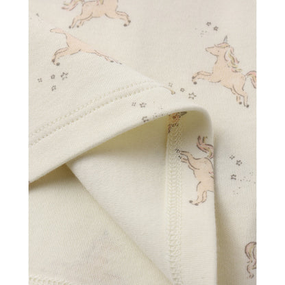Close-up of fabric with unicorn pattern on a white background