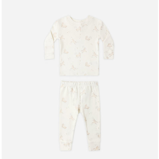 White baby onesie with floral pattern on a white background