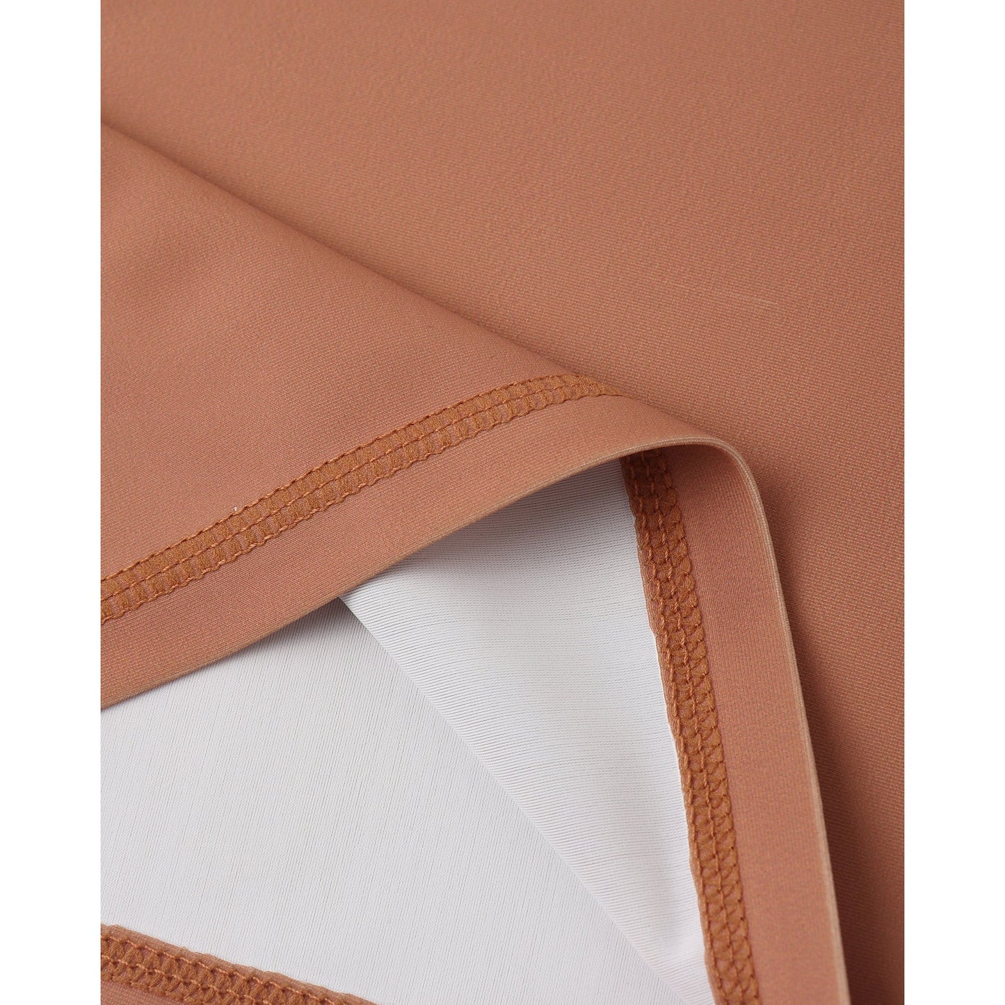 Close-up of brown fabric with a white background