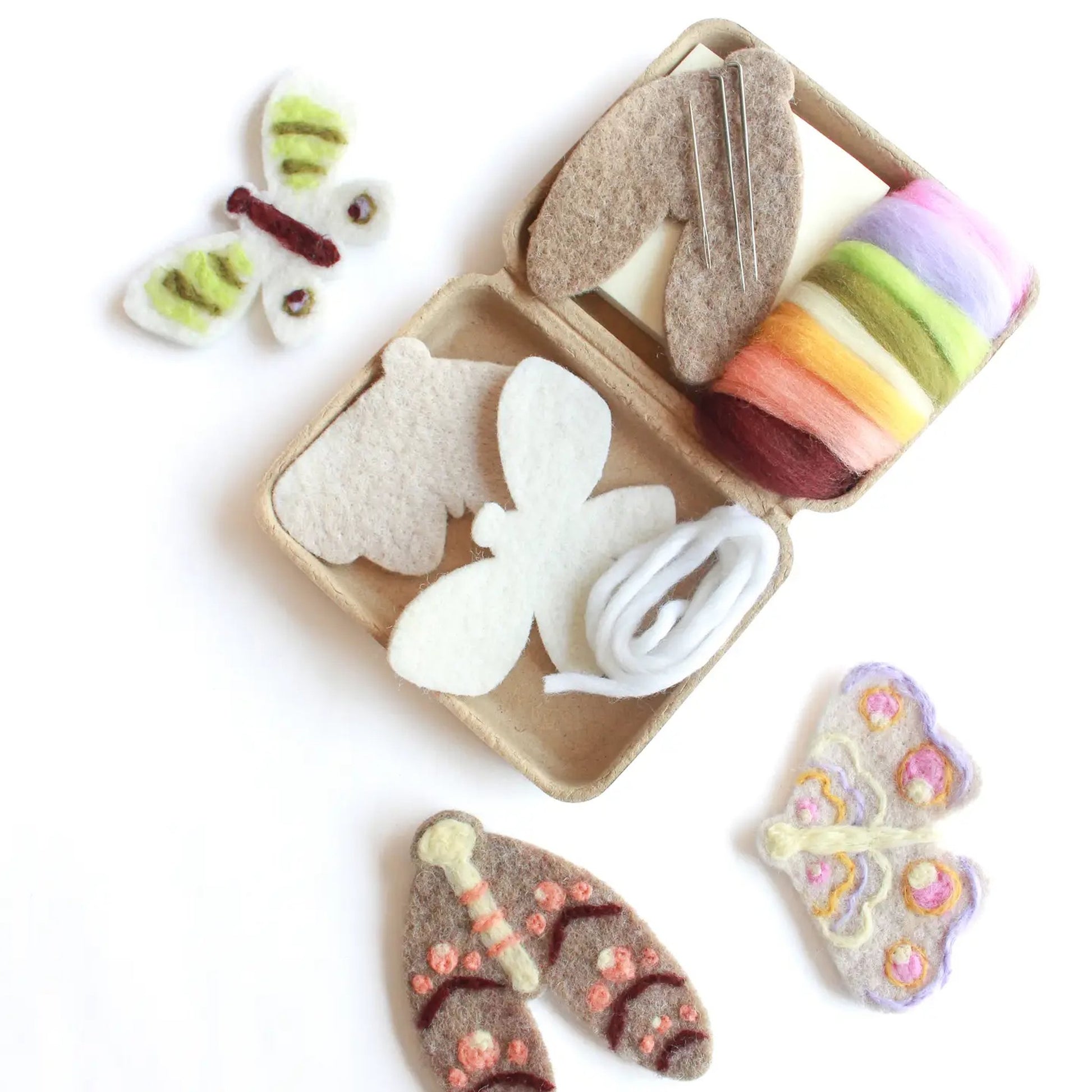 Butterfly-themed felt toys in a box on a white background
