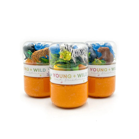 Three small orange containers with animal figurines labeled 'Young & Wild' on a white background.