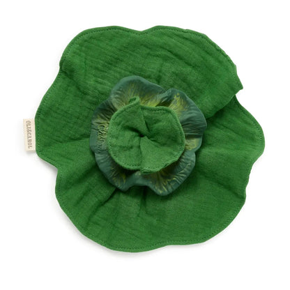 Green fabric flower on a white background