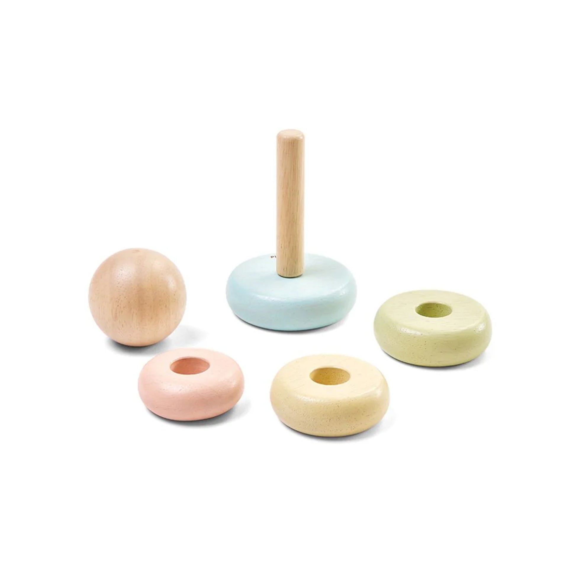 Set of pastel-colored wooden toys on a white background